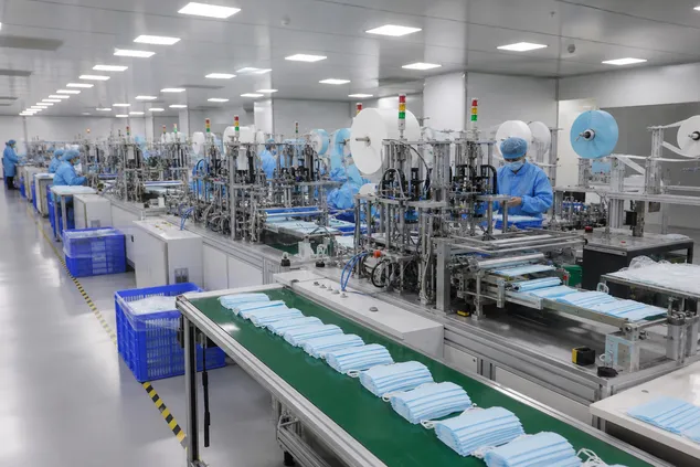 Automated mask production line at eztio facility — 6 fully automated lines producing 120 million pieces annually
