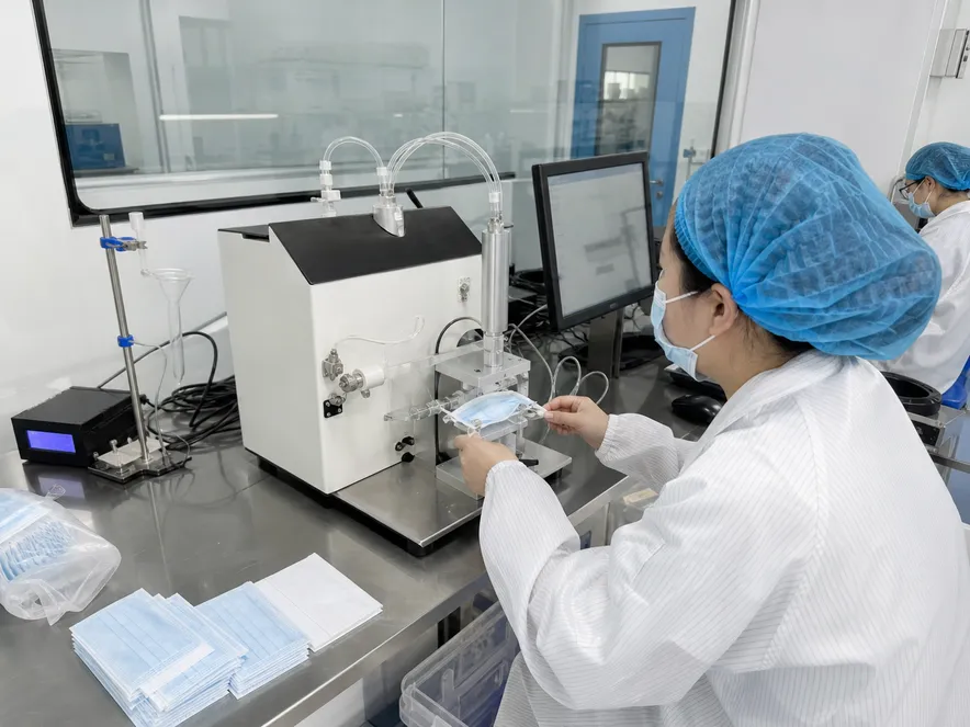 In-house QC lab running BFE and PFE filtration testing on medical mask batch