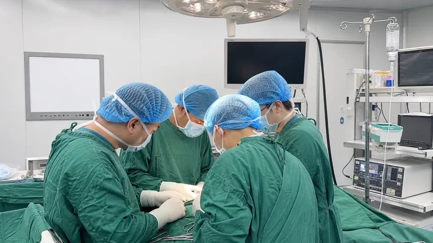 Surgical team wearing bouffant caps in an operating room environment