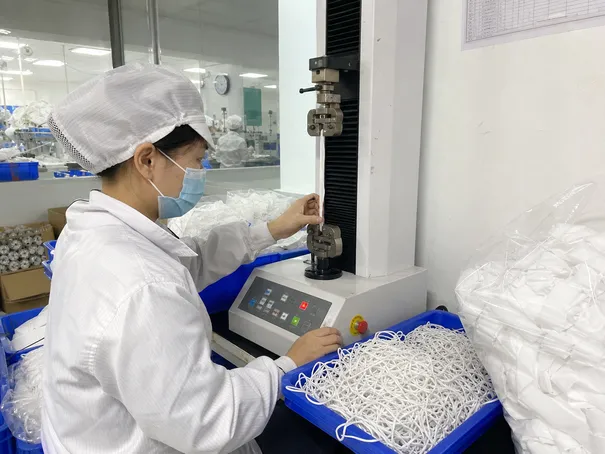 Elastic band tensile strength testing during incoming quality control