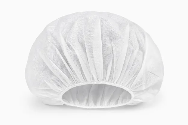 Bouffant medical cap with full-coverage gathered-crown design in spunbond nonwoven