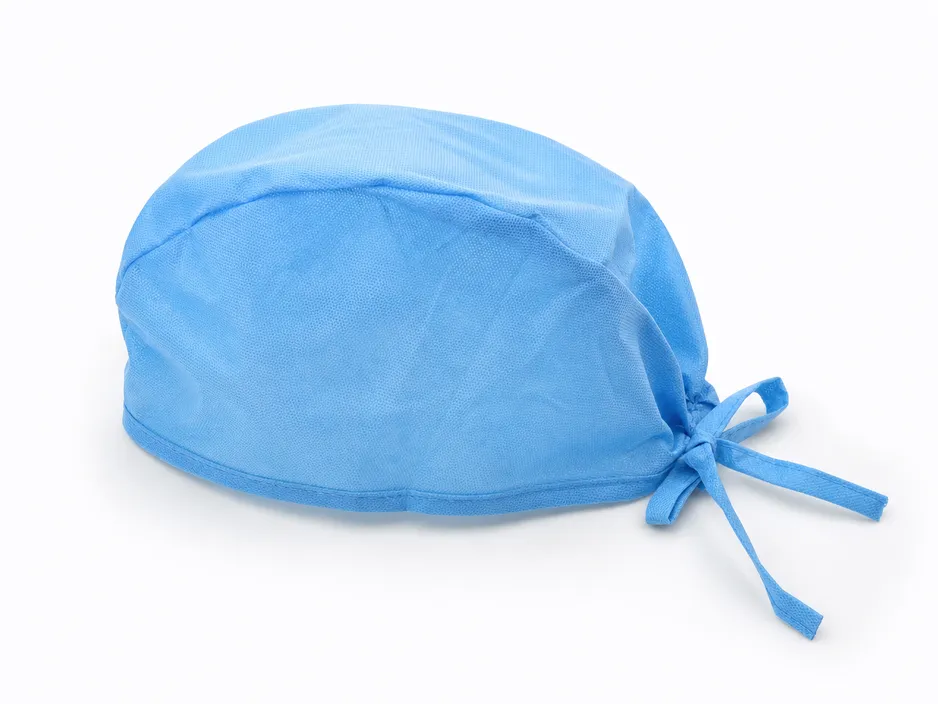 Disposable surgical medical cap with tie-back closure in blue spunbond polypropylene