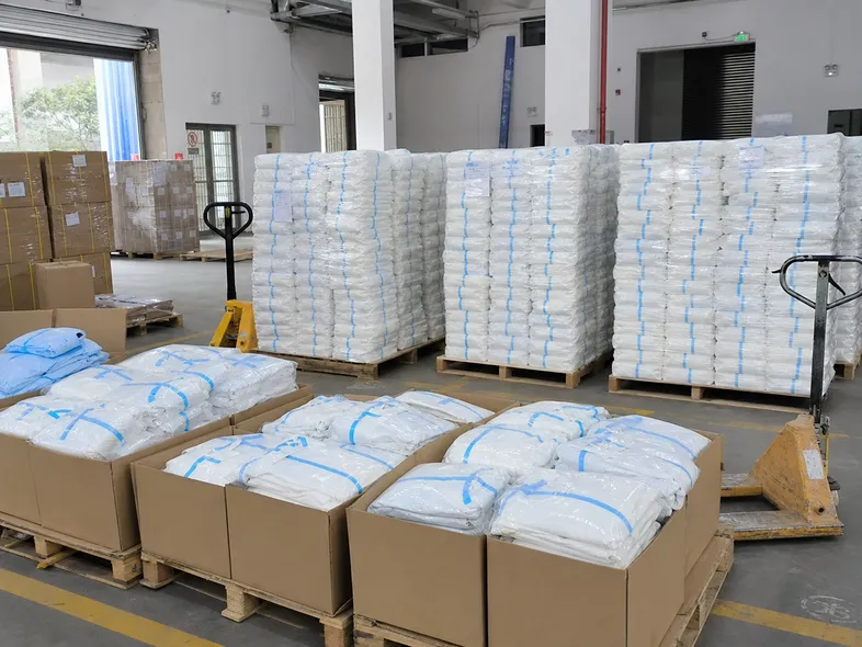 Bulk protective clothing pallets staged for government emergency stockpile delivery