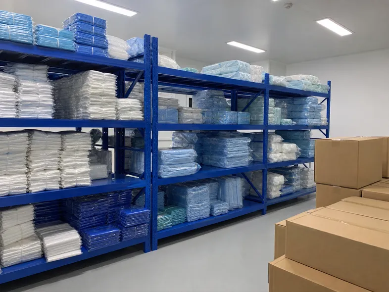 Healthcare distributor warehouse with organized PPE product lines including protective clothing