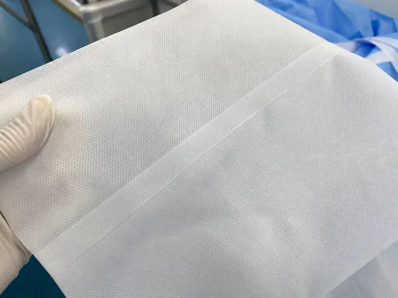 Ultrasonic welded seam close-up showing continuous homogeneous seal on protective clothing