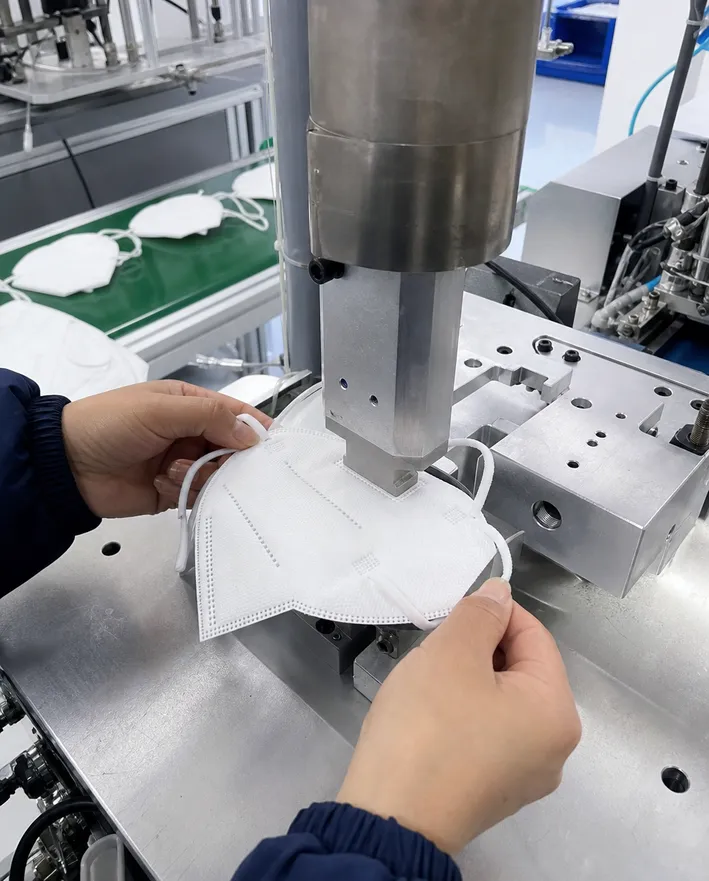 Ultrasonic welding process on N95 mask ear-loop attachment